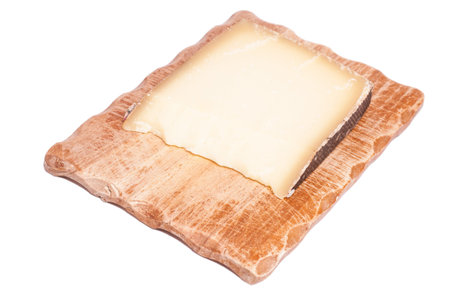 French gruyere cheese on a wooden board