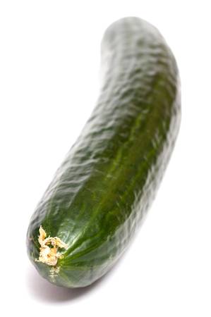 Green cucumber in vertical format on a white backgroundの写真素材