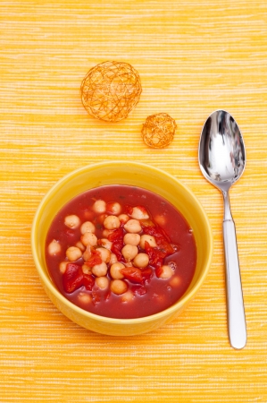 Soup with chickpeas and tomatoes in vertical-formatの写真素材
