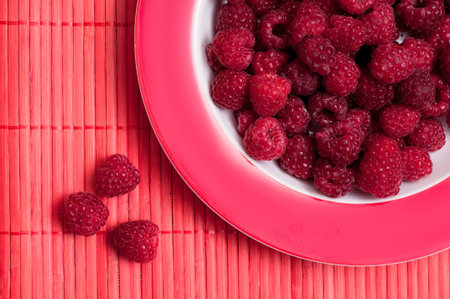 Close up of red raspberries on a plateの写真素材