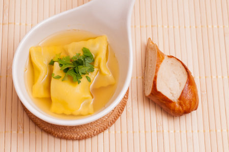 Broth with swabian pockets added in soupの写真素材