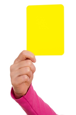 Female hand is showing a yellow cardの写真素材