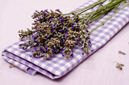 Flowers of purple lavender on a checkered clothの写真素材