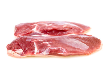 Two raw duck breasts on white backgroundの写真素材