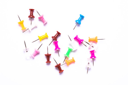 Coloured pins as marker on white groundの写真素材