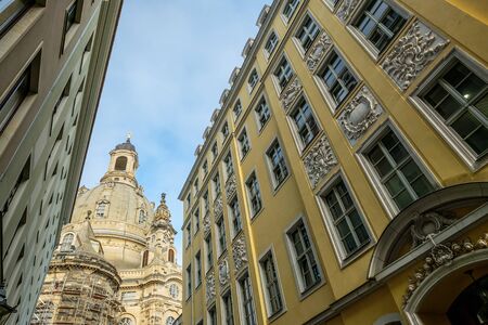 Historical buildings with stucco at the facade with Frauenkirche in Dresdenの写真素材
