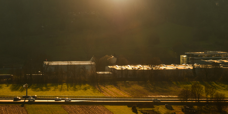 Cars on a federal highway in warm light and backlight of the sunの写真素材