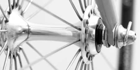 Close-up biycicle hub with screw chromed at a bike forkの写真素材