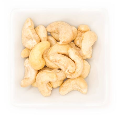 Cashew nut in a white square bowl in top viewの写真素材