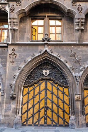 New city hall door in Munich with child in vertical formatの写真素材