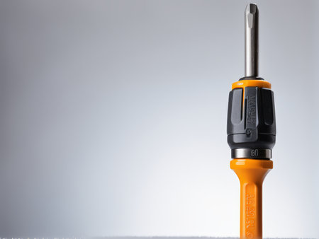 Close-Up Shot of Screwdriver with Length Indication 35mm Against Grey Backgroundの素材