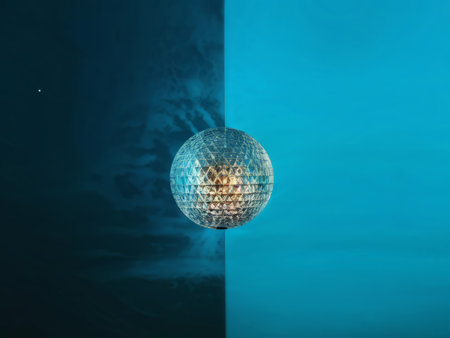 Glittering Geometries in Cool Contrast: A Disco Ball's Reflections Against a Shiny Surface Compositionの素材
