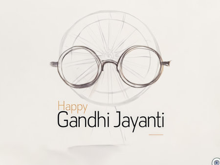 An advertisement for Happy Gandhi Jayanti featuring an eyeglasses illustration with a wheel design in the background. The text is written above the glasses, prominently displayed aの素材