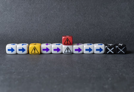The image shows a series of dice with various symbols in different colors arranged from left to right across a gray background. Each die is rectangular in shape, has rounded edges,の素材