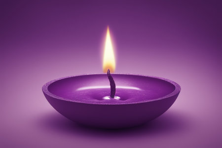 candle burning on a purple backgroundの素材