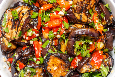 grilled eggplant and paprika with herbs, garlic and olive oilの写真素材