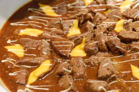 Beef stewed in a creamy sauce with butter and cheese.