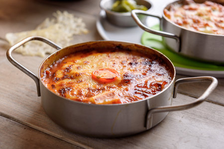close up of rustic italian lasagna in a metal potの写真素材