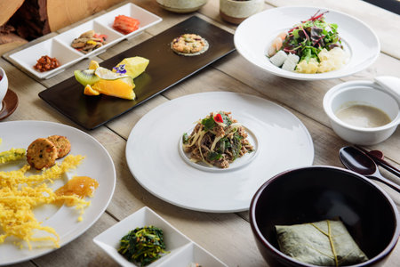 Rice noodles with vegetables and sauce on a wooden table in a restaurant