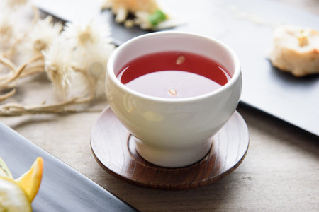 Cup of tea on a wooden table, selective focus, close-upの写真素材