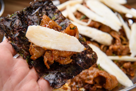 Place red pepper paste bulgogi and korean wild chive on seaweedの写真素材