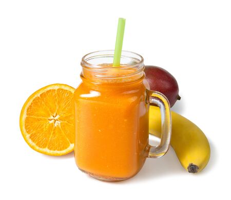 Mango orange and banana smoothie with ingredients isolated on white background. Selected focus.の写真素材