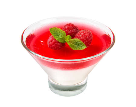 Raspberries milk jelly in a ice cream bowl with mint leaves, isolated on a white background. Close-up.の写真素材