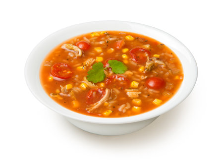 Easy Mexican chicken and rice soup in a white soup bowl isolated on a white background.の写真素材