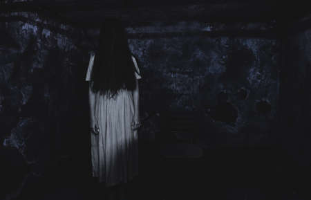 toy made of toilet paper in the form of a ballerina. The toy is held by a girl locked in a cellar who wants to learn to dance.の写真素材