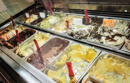 a lot of different ice cream in the big bowlsの写真素材