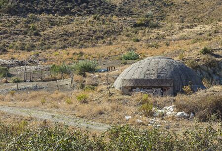 Close-up of one of the countless military concrete bunkers or dots in the southern Albania  built during the communist government of Enver Hoxhaの写真素材