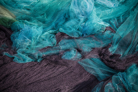 Traditional fishing net with floats on the shore after fishingÐ± foshing net background.