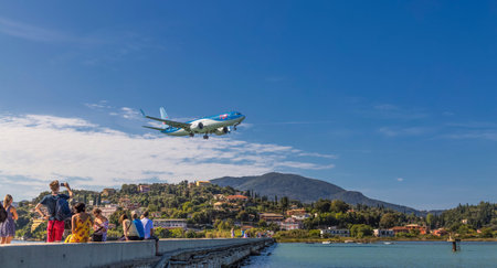 Kerkira, Corfu/ Greece - September 24  2018 : Tourists watch the plane Boeing 737 MAX 8 of Tuifly...