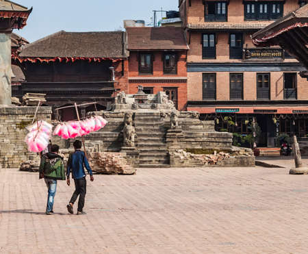 Kathmandu, Nepal - March 2016: candy floss sellers on Durbar Square, a UNESCO World Heritage Site, damaged after the major earthquake on 2015.のeditorial素材