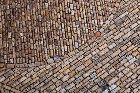 Cobble paving stone brick sidewalk of old town. Abstract background.の写真素材