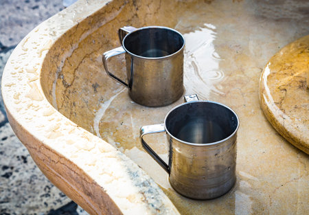 Natla, a cup used for ritual washing in Judaism, near the Western wall in Jerusalem