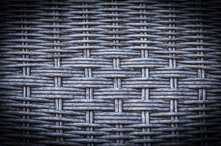 Gray artificial rattan pattern background of structure close-up. Furniture backdrop.の写真素材