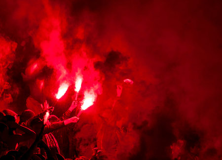 Football fans lit up the lights, flares and smoke bombs. Protest concept.