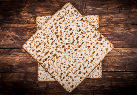 Two pieces of jewish passover matzah (unleavened bread) in form of Jewish Star of David Magen David...