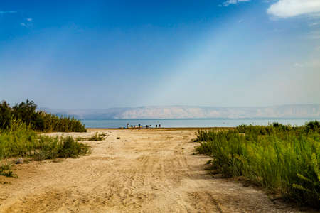 View of the sea of Galilee (Lake Tiberias, Kinneret or Kinnereth), beach with tire tracks and pontoon pier. The lowest freshwater lake on Earth. Israel.の写真素材