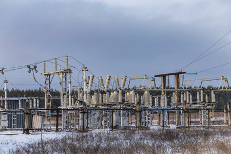 High voltage obsolete vintage electrical substation in winter. Closeup on wiring, connections and...