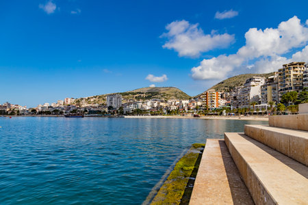 Panoramic view of Saranda bay and town and city port along the coast, Albania. Sunny summer day. Beautiful clouds in the sky. Calm blue sea.のeditorial素材