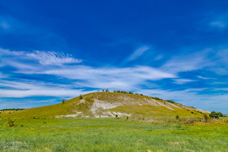 White chalk rocks or mountains or hills in chalk steppe, the Dvorichanskyi National Nature Park...