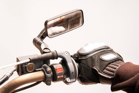 Biker hand rests on the steering wheel motorcycleの写真素材