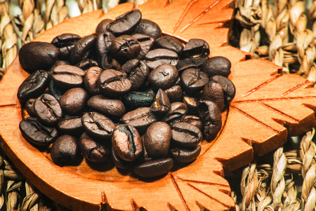 Roasted coffee beans in the wicker basket.の写真素材