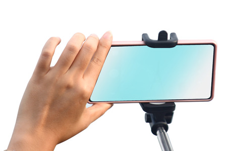 woman hands holding a smart phone with a blank screen isolated over a white backgroundの写真素材