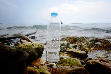 Water bottles on the rocky beach