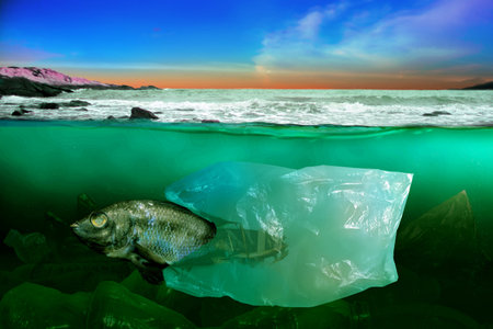 Fish swim amongst the garbage in the ocean. Plastic bag pollution problem under the sea concept...