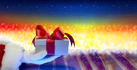 santa claus holding christmas giftsの写真素材