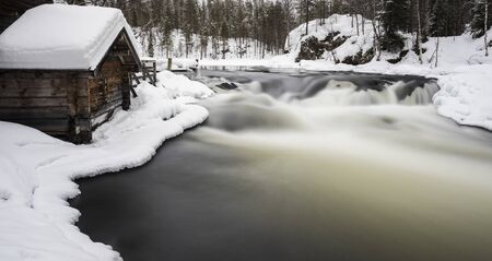 Old mill next to the river within Oulanka national parkの写真素材